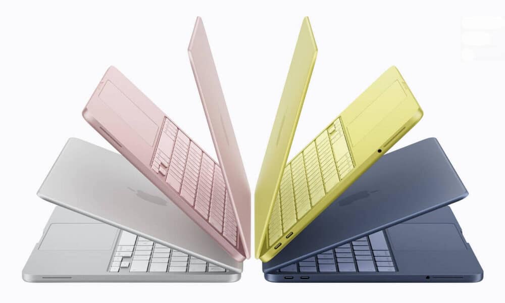 MacBooks colorés alignés en éventail sur fond blanc.