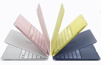 MacBooks colorés alignés en éventail sur fond blanc.