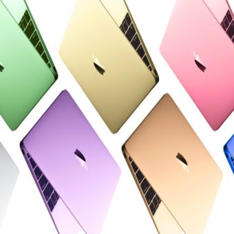 MacBooks multicolores sur fond blanc.